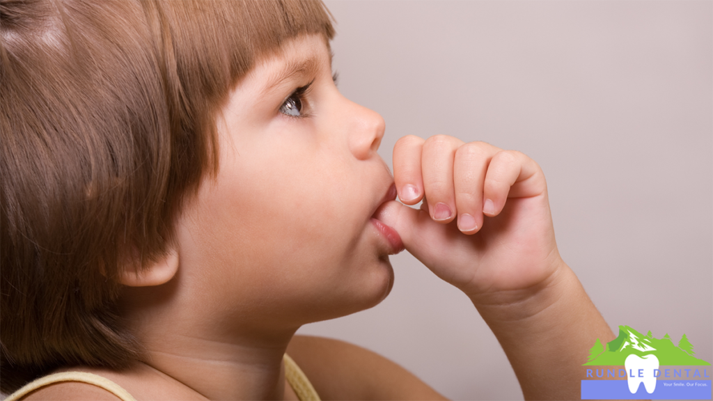 A child sucking their thumb.